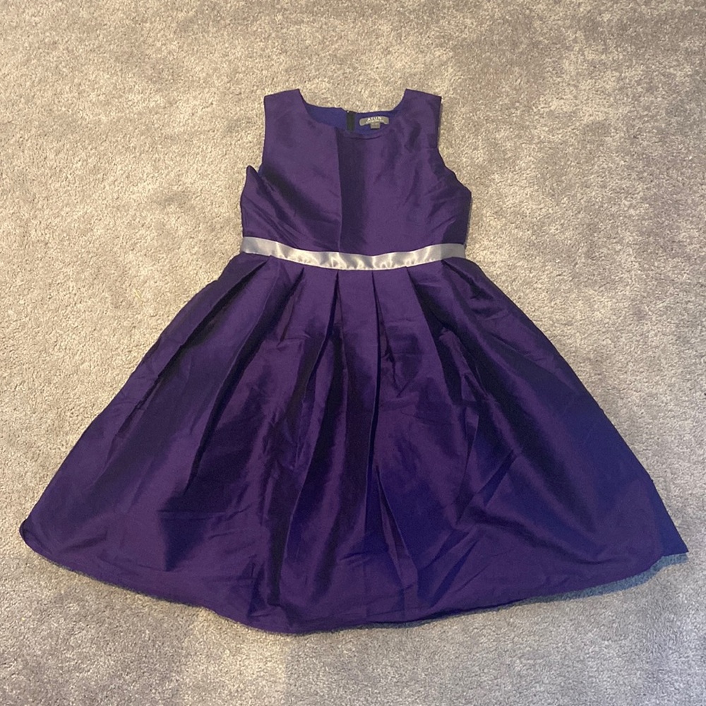 Purple dress with silver waist stripe.